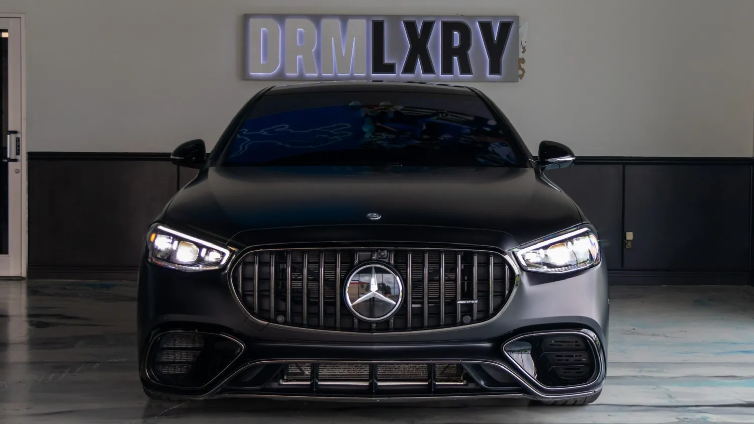 Matte black Mercedes-AMG S63 E Performance rental in Detroit, front view with the AMG grille