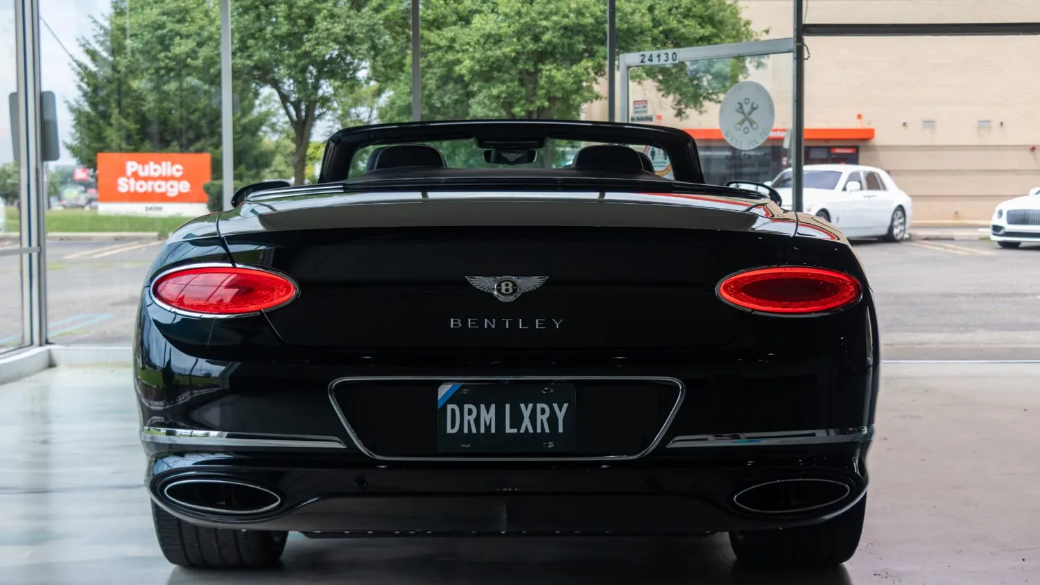 Black Bentley Continental GTC rental in Detroit, rear view