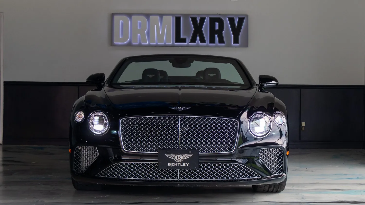 Black Bentley Continental GTC rental in Detroit, front grille and headlights