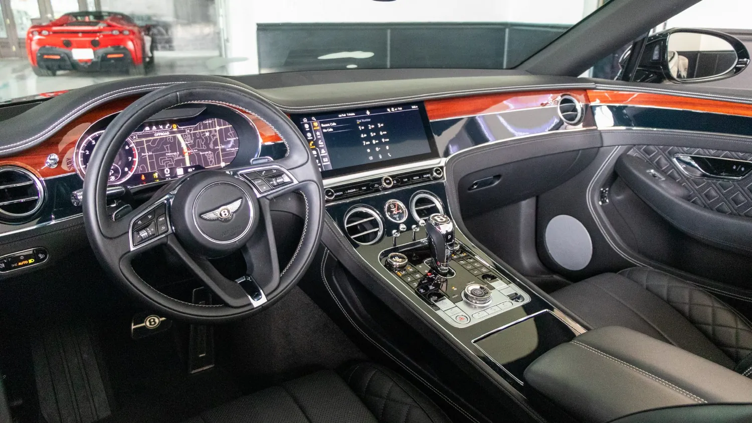 Black Bentley Continental GTC rental in Detroit, dashboard and steering wheel