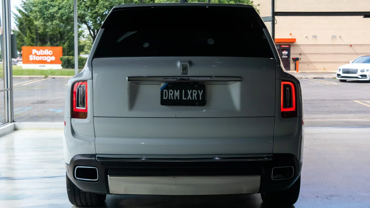White Rolls-Royce Cullinan rental in Detroit, rear view