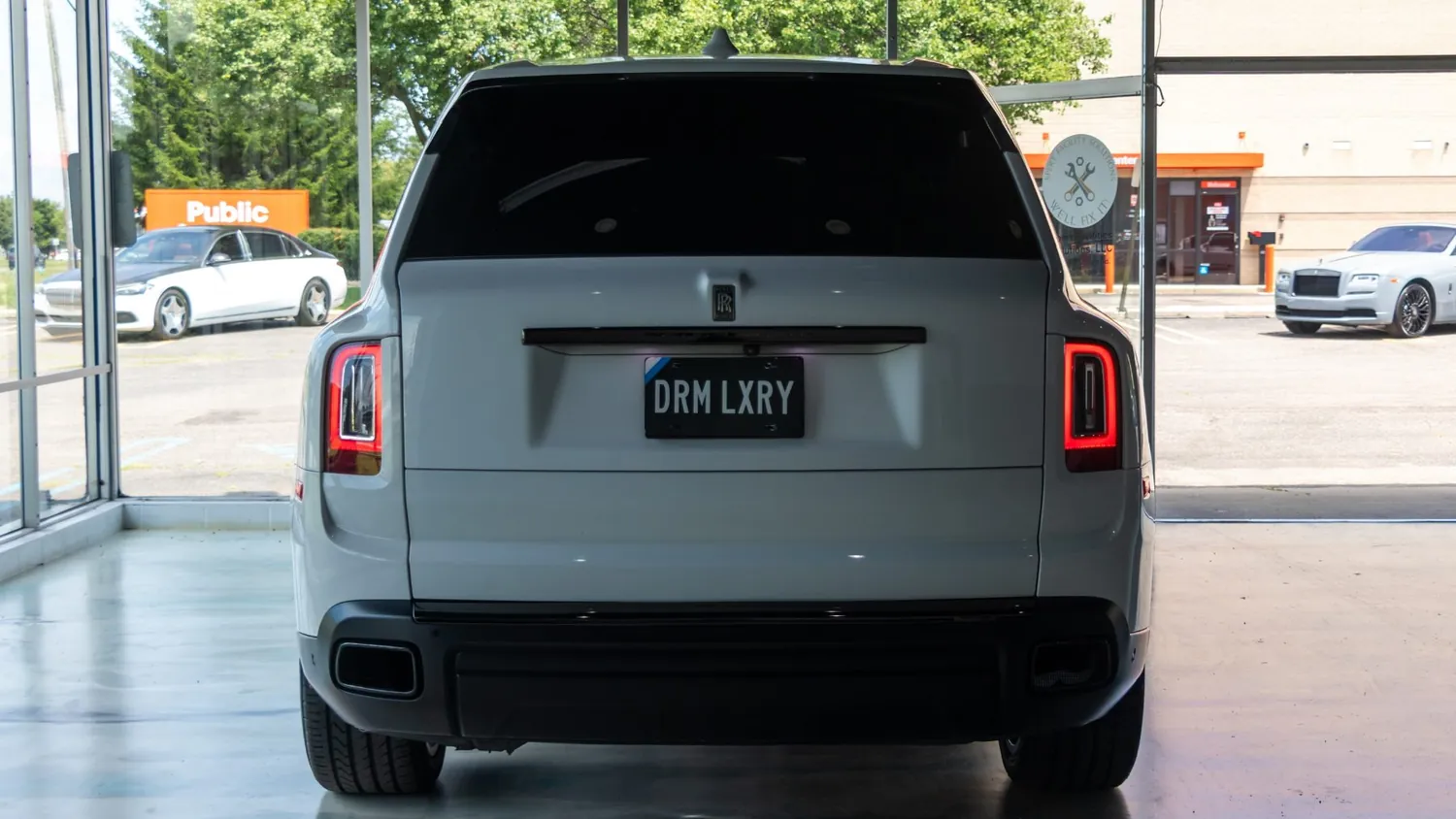 White Rolls-Royce Cullinan rental in Detroit, rear view