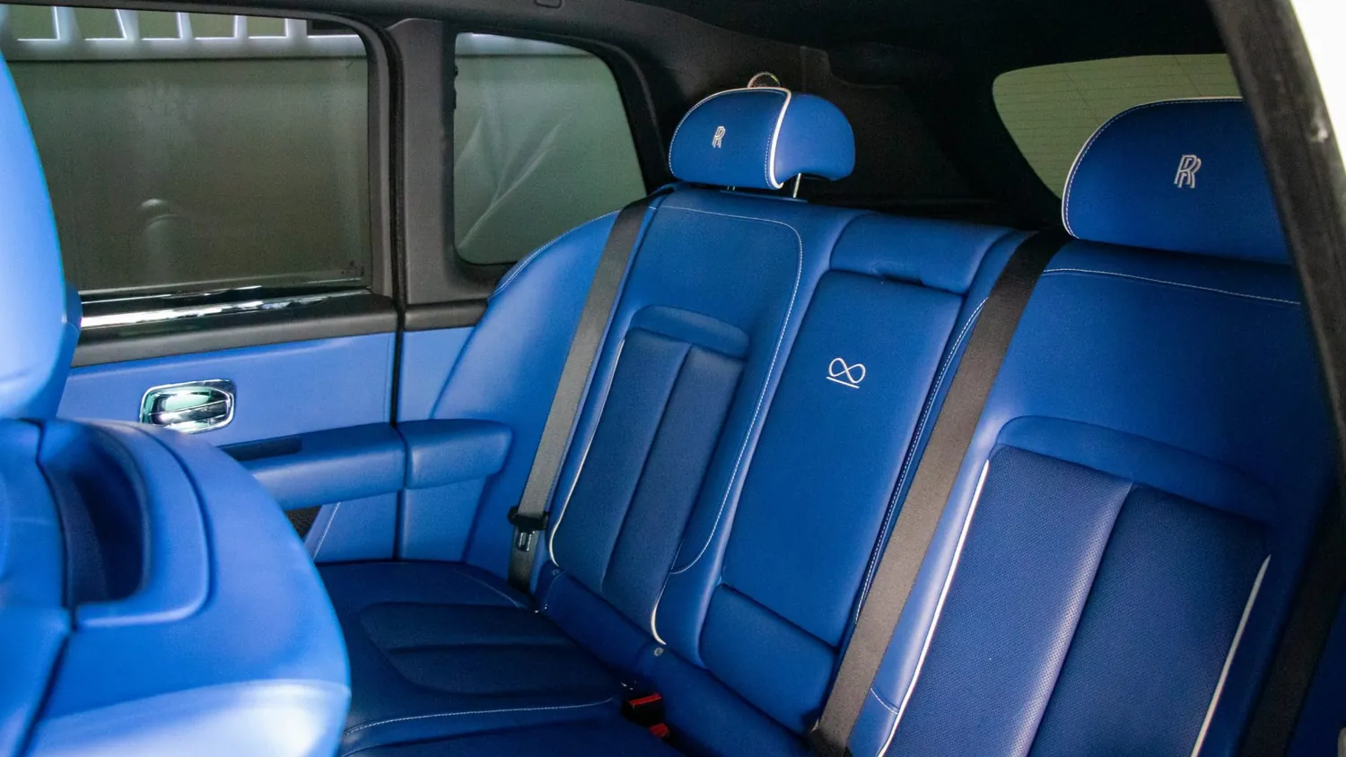 White Rolls-Royce Cullinan rental in Detroit, rear seats