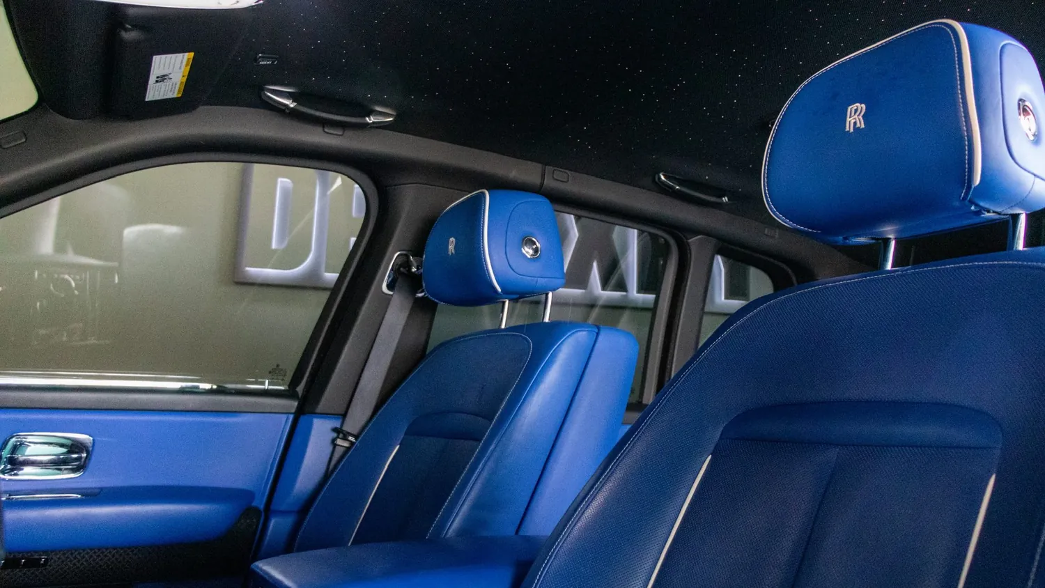 White Rolls-Royce Cullinan rental in Detroit, front seats