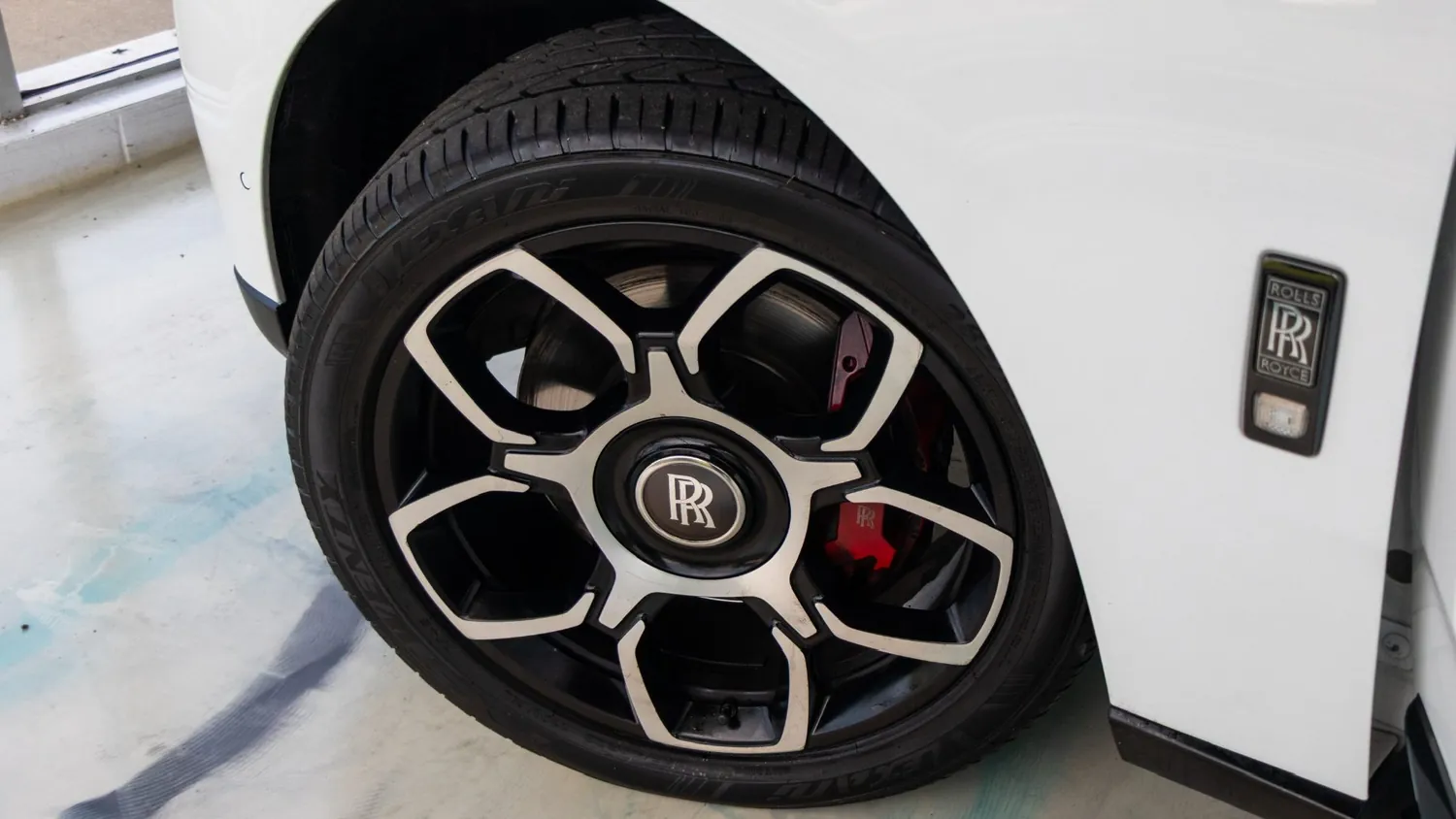White Rolls-Royce Cullinan rental in Detroit, wheel and brake detail