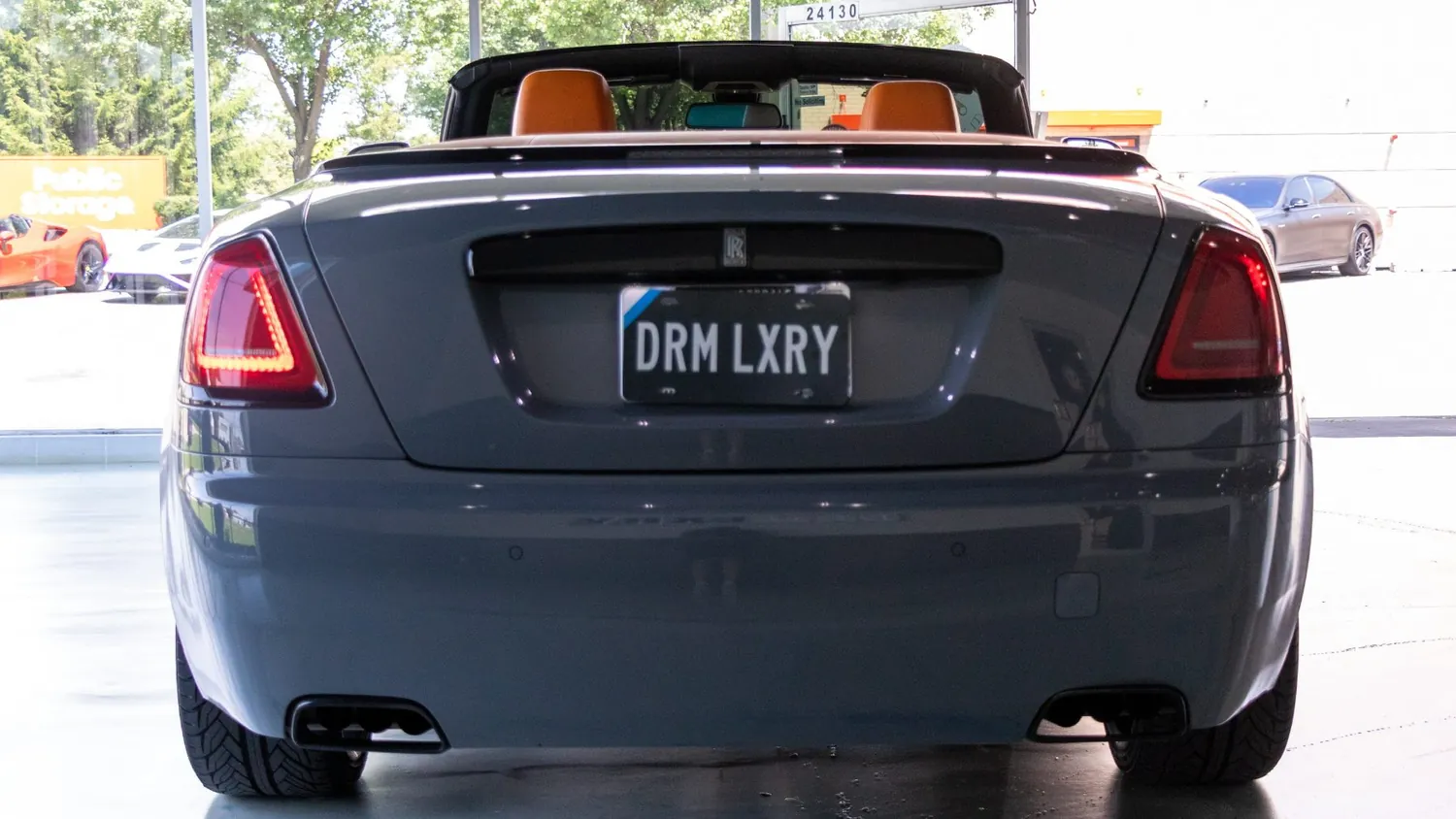 Silver Rolls-Royce Dawn rental in Detroit, rear view