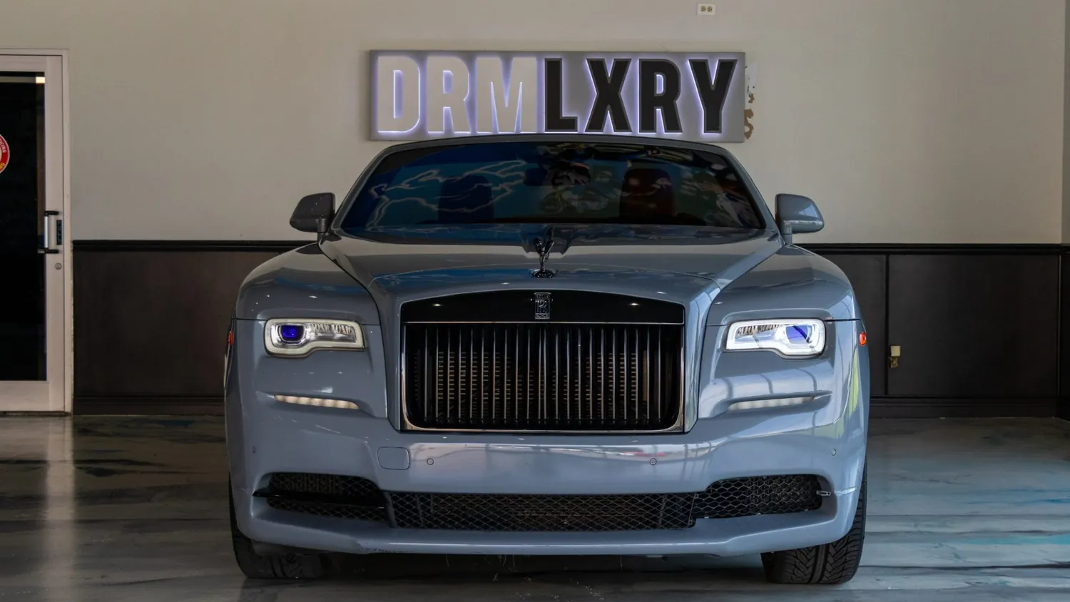 Silver Rolls-Royce Dawn rental in Detroit, front grille and Spirit of Ecstasy