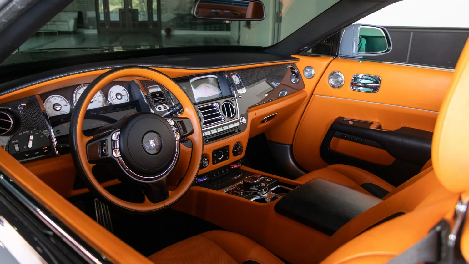 Silver Rolls-Royce Dawn rental in Detroit, dashboard and steering wheel