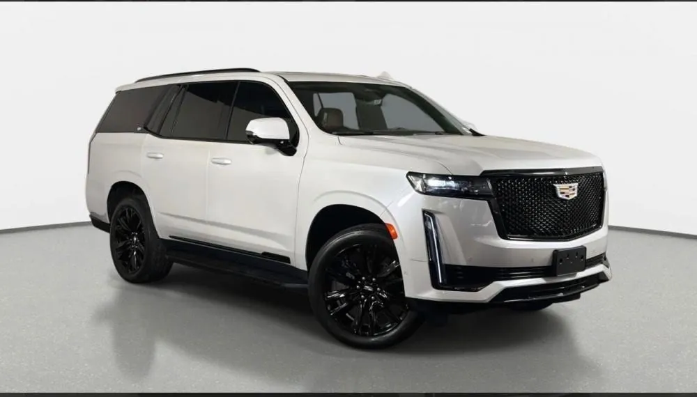 White Cadillac Escalade ESV rental in Detroit, front three-quarter view