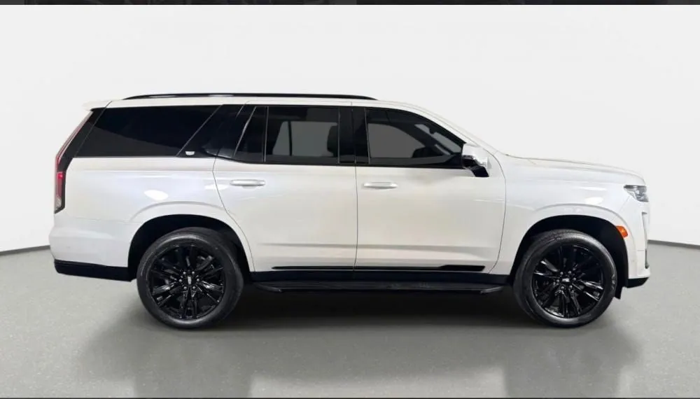 White Cadillac Escalade ESV rental in Detroit, side profile