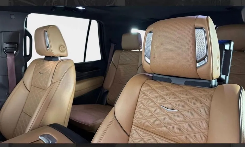 White Cadillac Escalade ESV rental in Detroit, front seats in tan leather