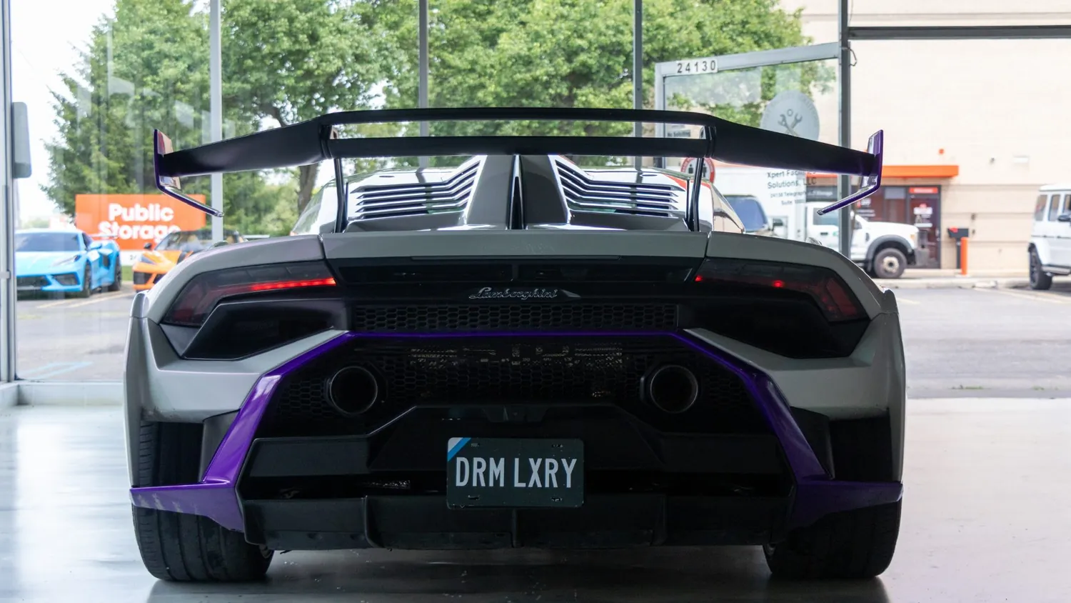 White Lamborghini Huracán STO rental in Detroit, rear view with the fixed wing