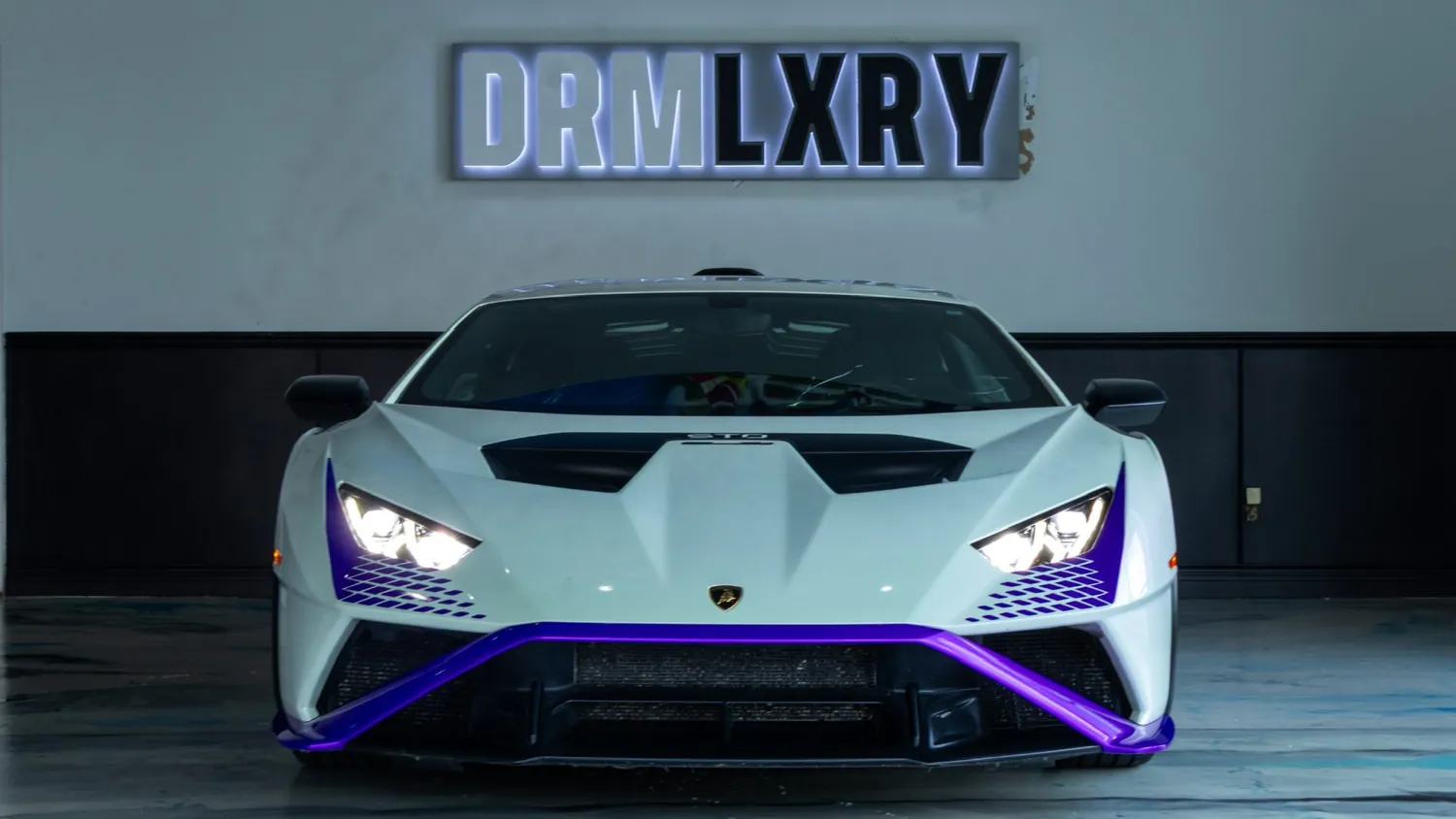 White Lamborghini Huracán STO rental in Detroit, front view