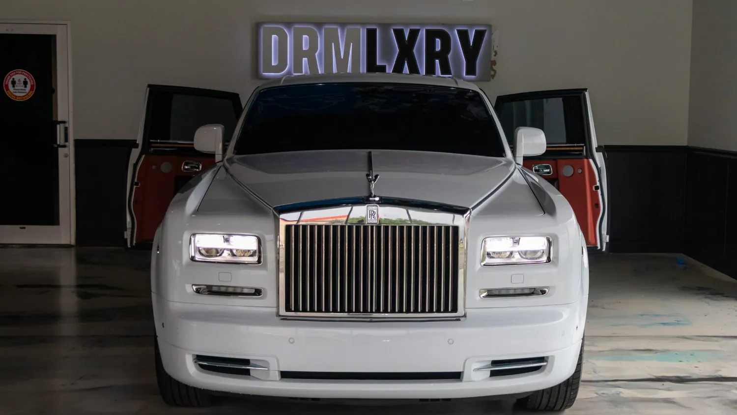 White 2017 Rolls-Royce Phantom rental in Detroit, front view with the doors open