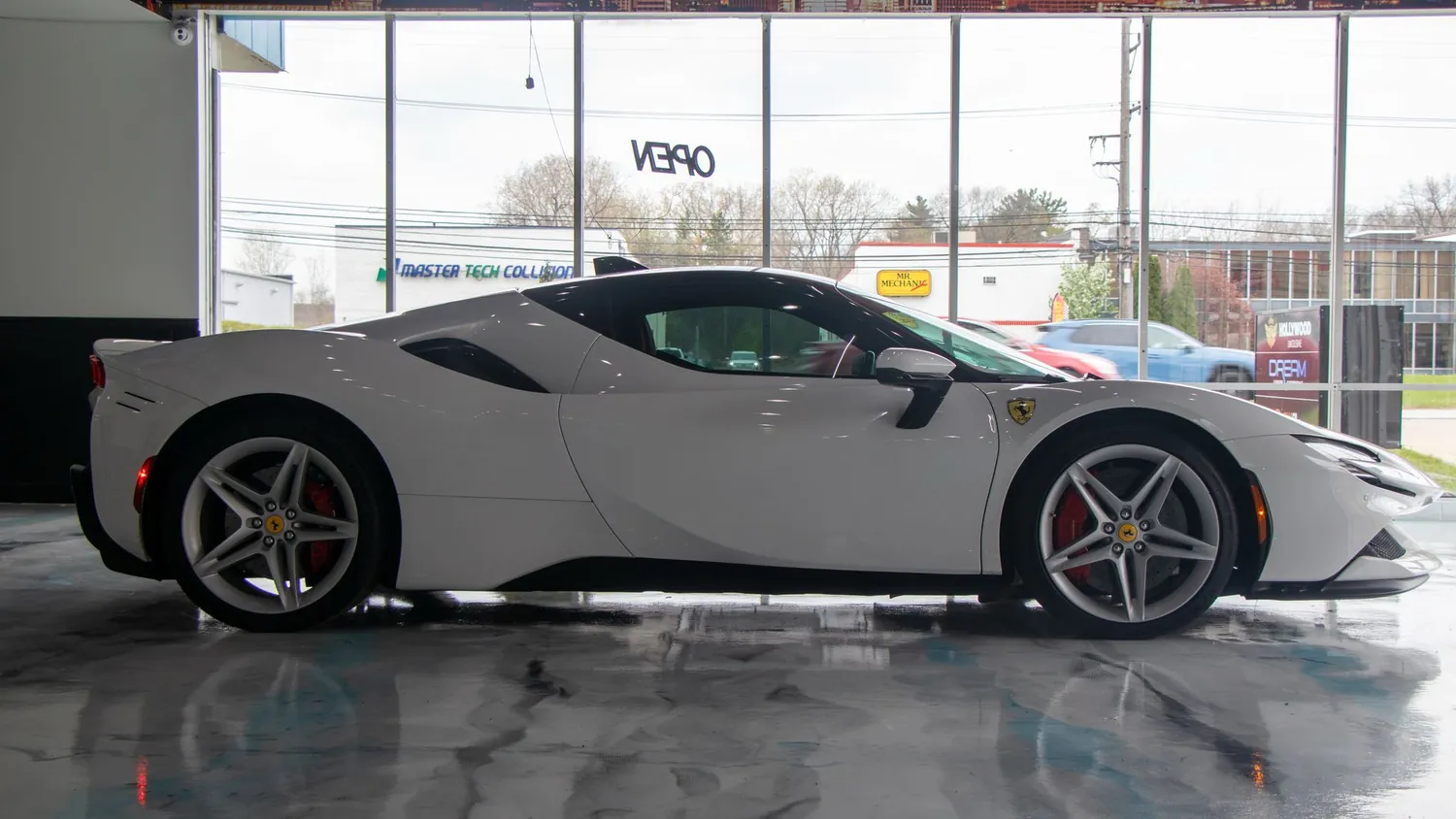 White Ferrari SF90 Stradale rental in Detroit, side profile