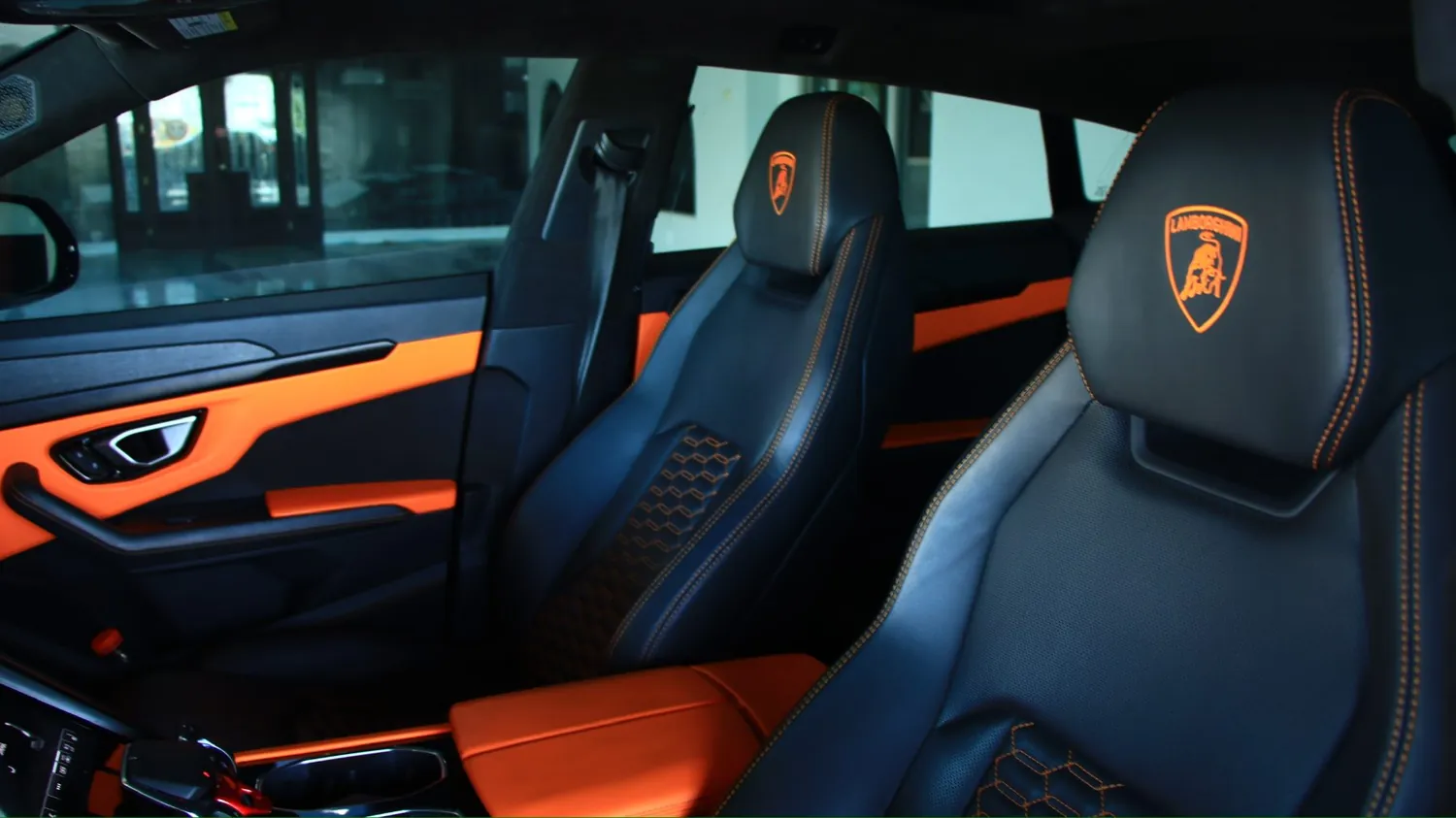 Gray 2022 Lamborghini Urus rental in Detroit, front seats