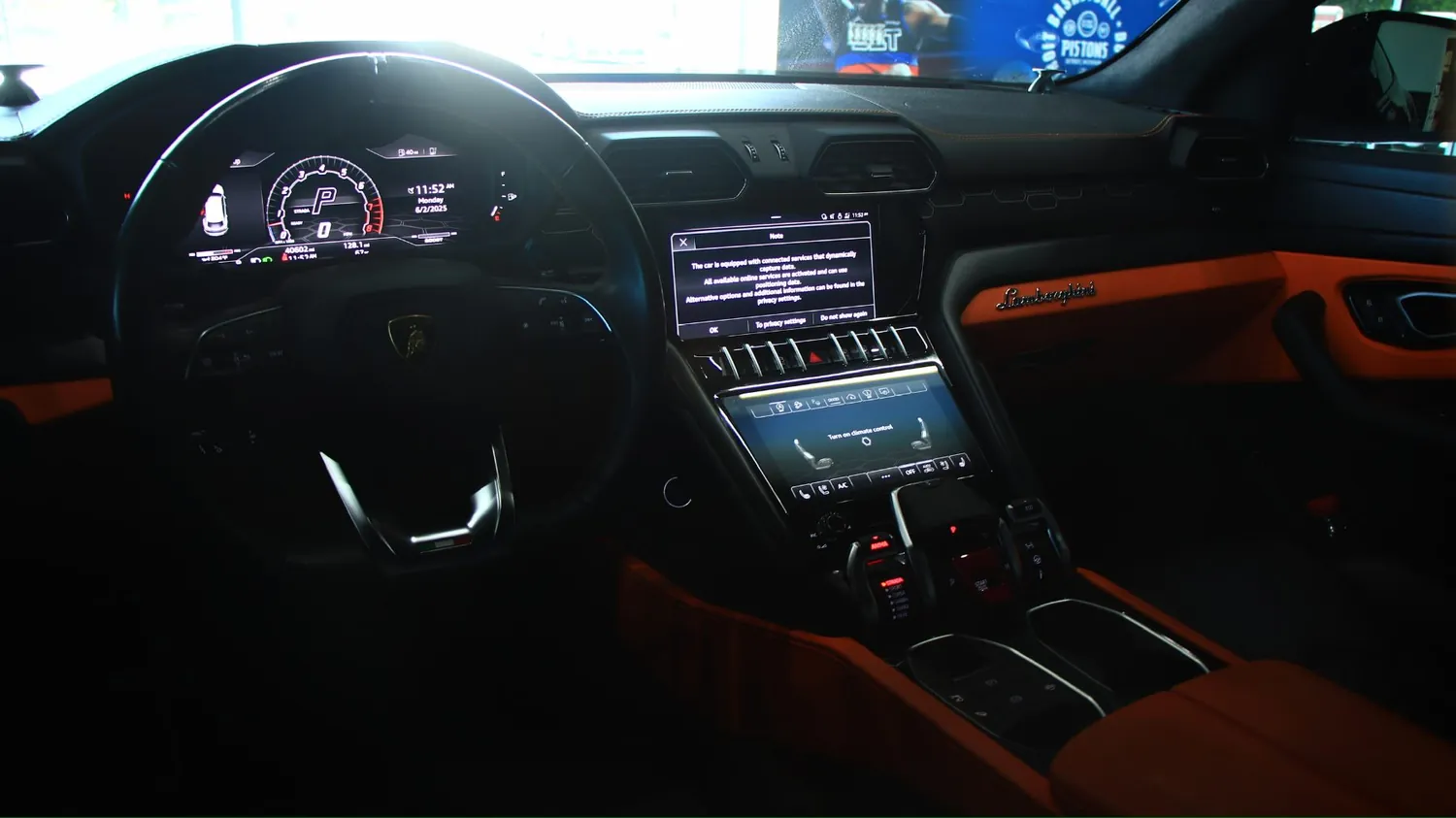 Gray 2022 Lamborghini Urus rental in Detroit, dashboard and screens
