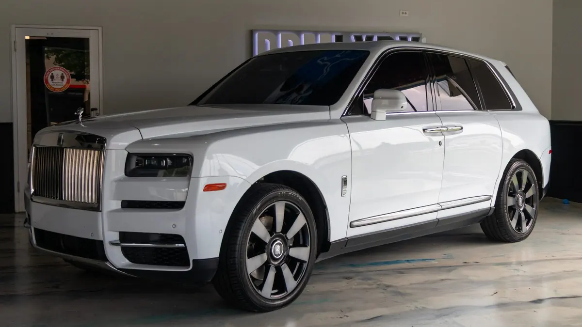 Rolls-Royce Cullinan three-quarter view in the DRMLXRY showroom