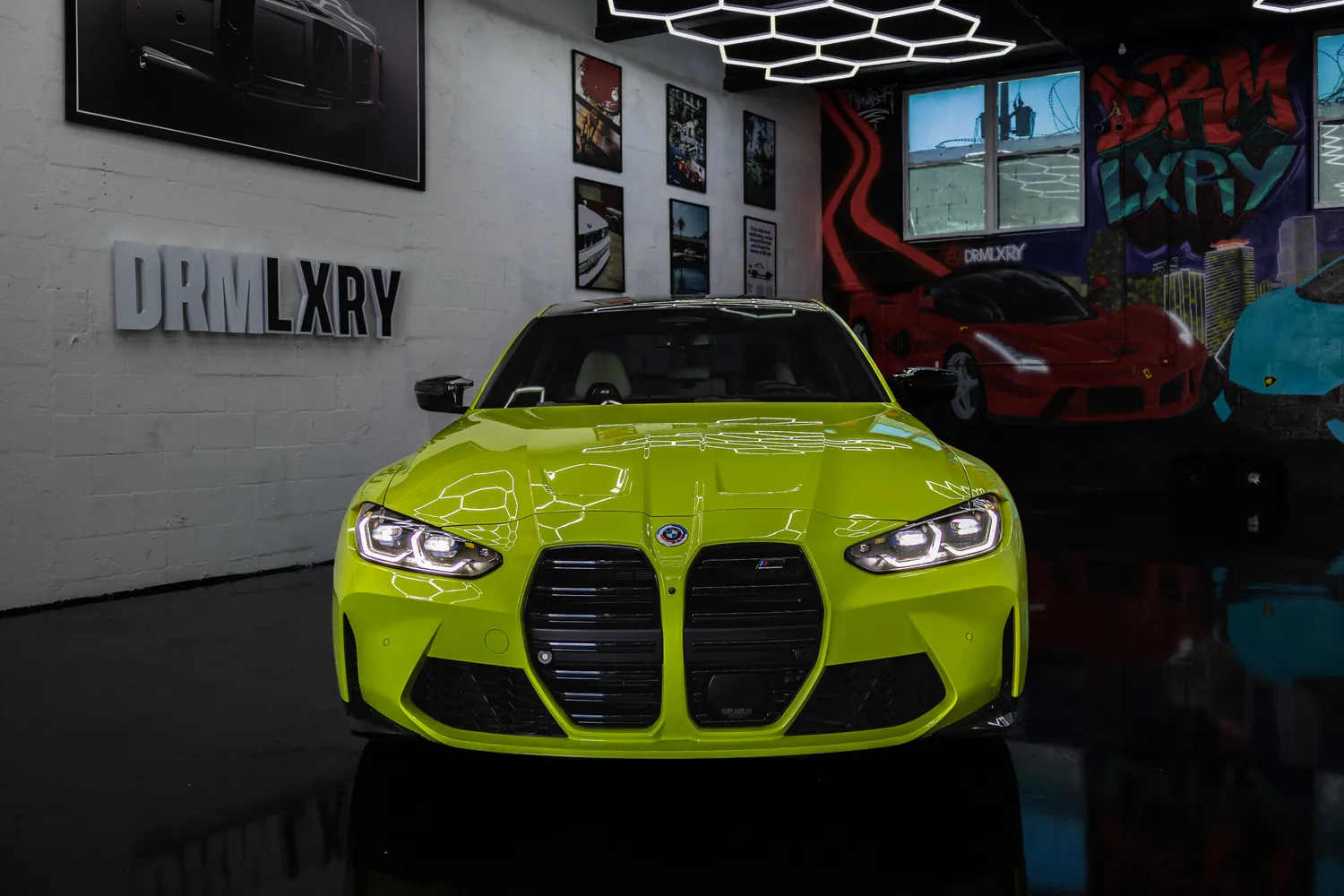 Front view of the yellow BMW M3 Competition with its large kidney grille