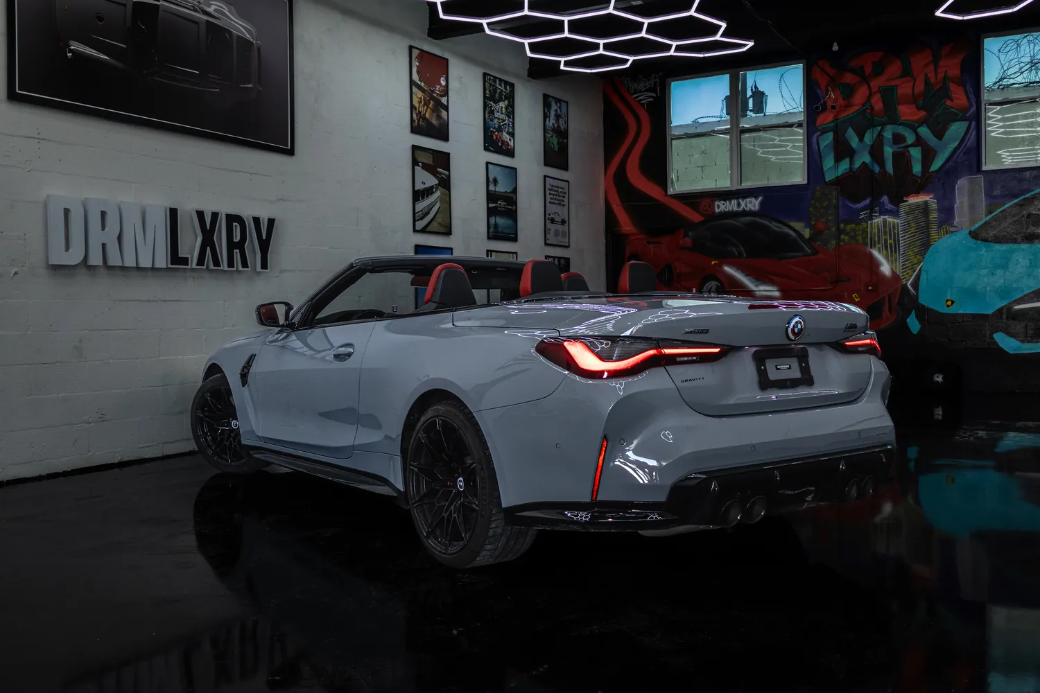 Grey BMW M4 Competition Convertible, rear three-quarter view