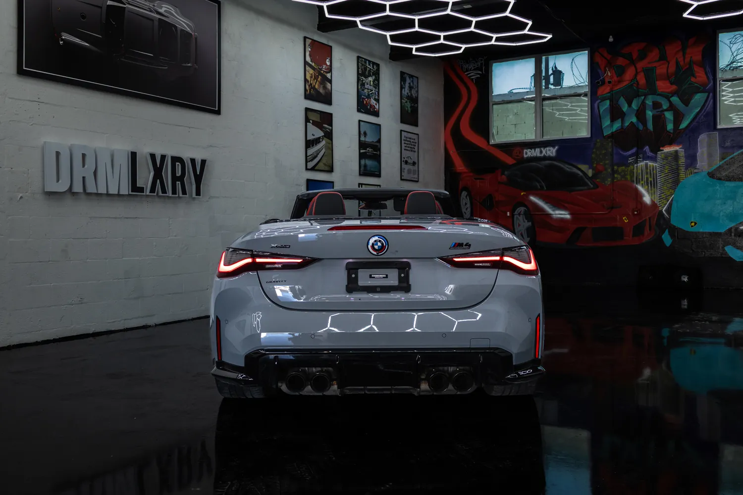 Rear view of the grey BMW M4 Competition Convertible with quad exhaust