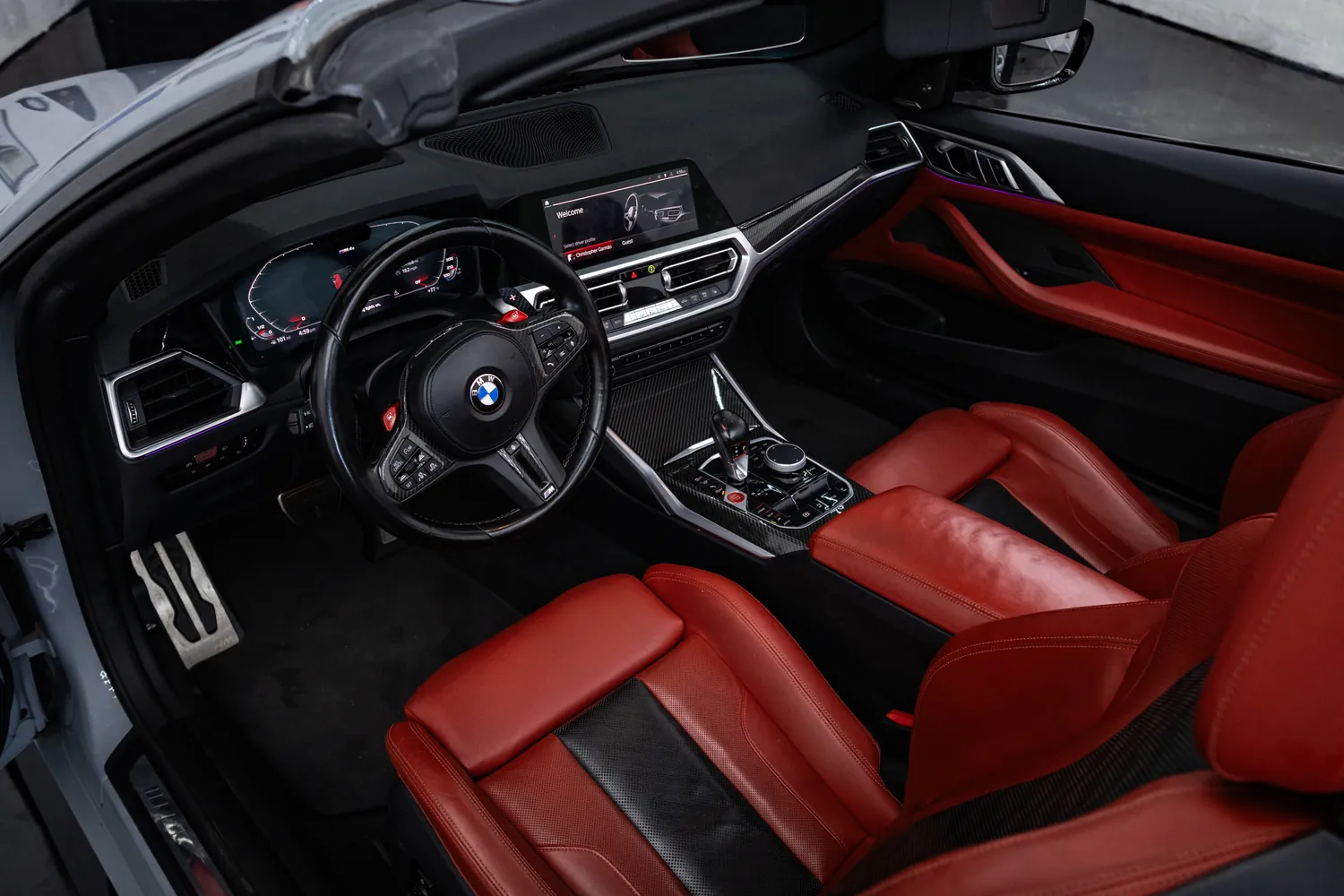 BMW M4 Competition Convertible dashboard and red leather seats