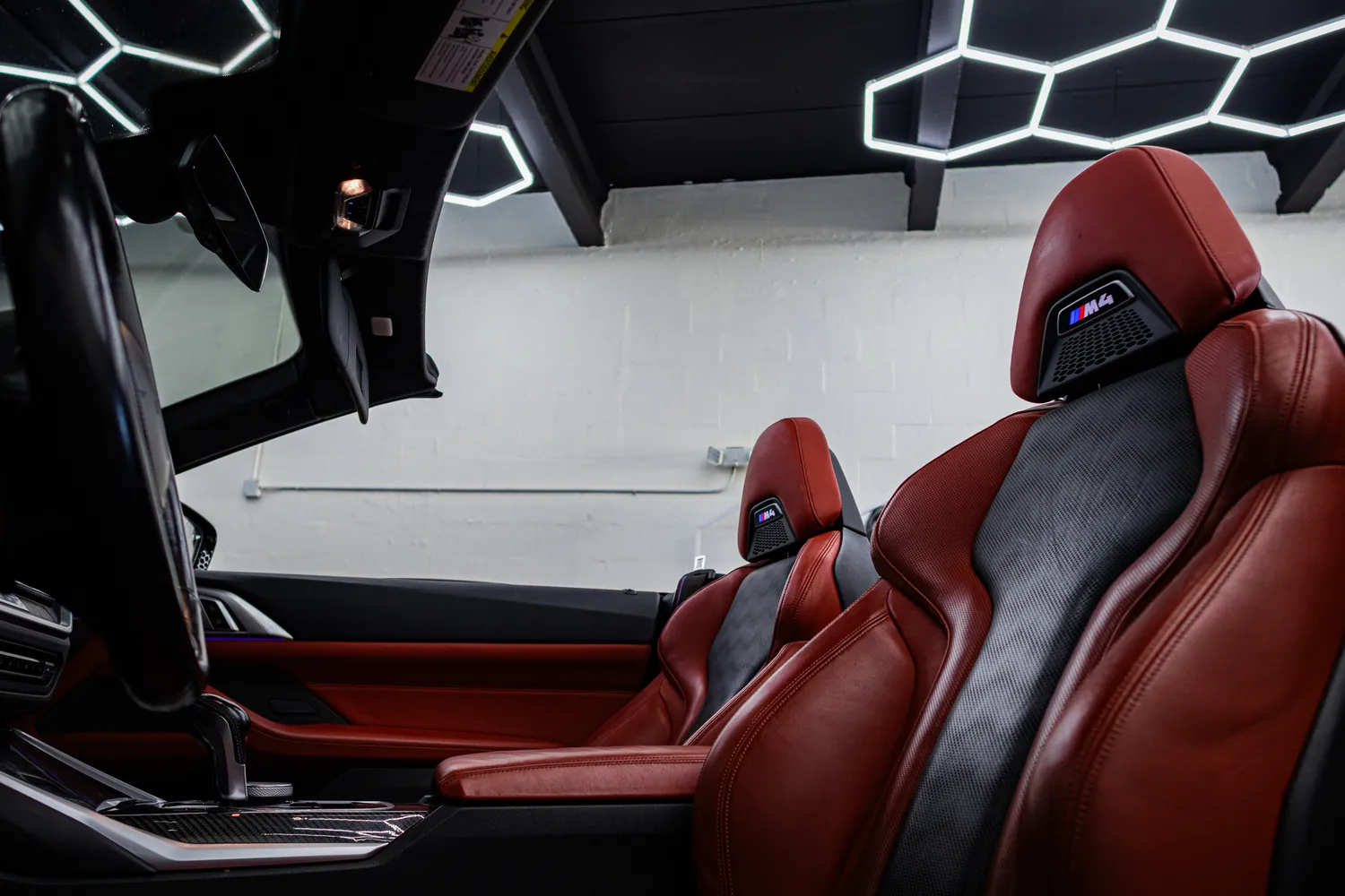 Red and black M sport seat in the BMW M4 Competition Convertible