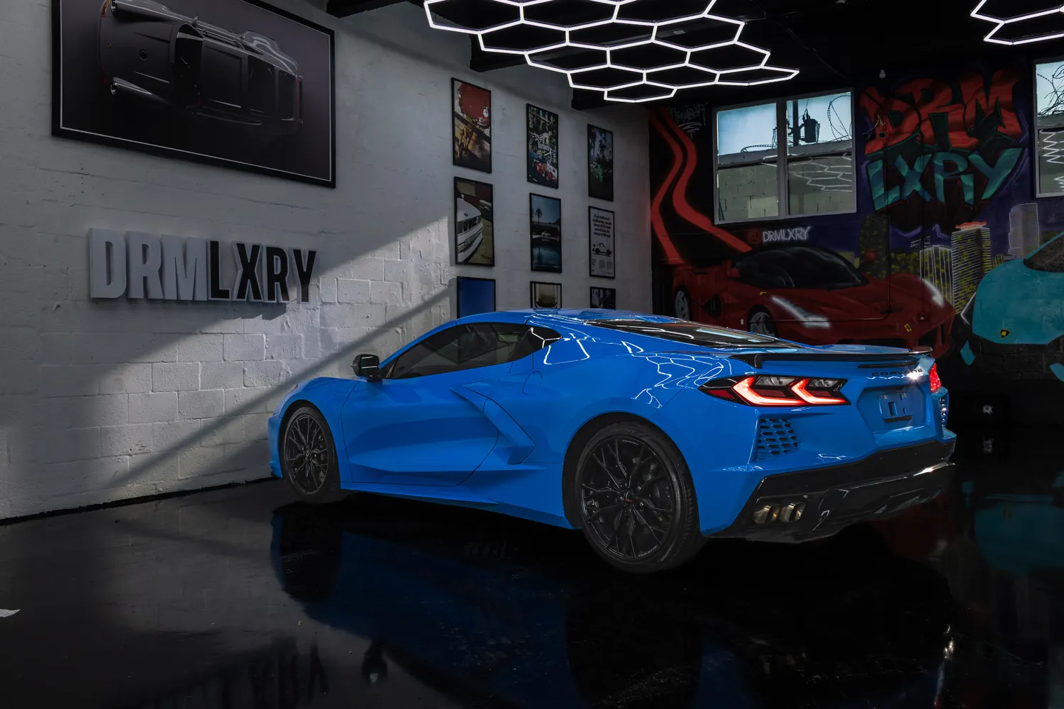 Blue Corvette Stingray, rear three-quarter view from the left
