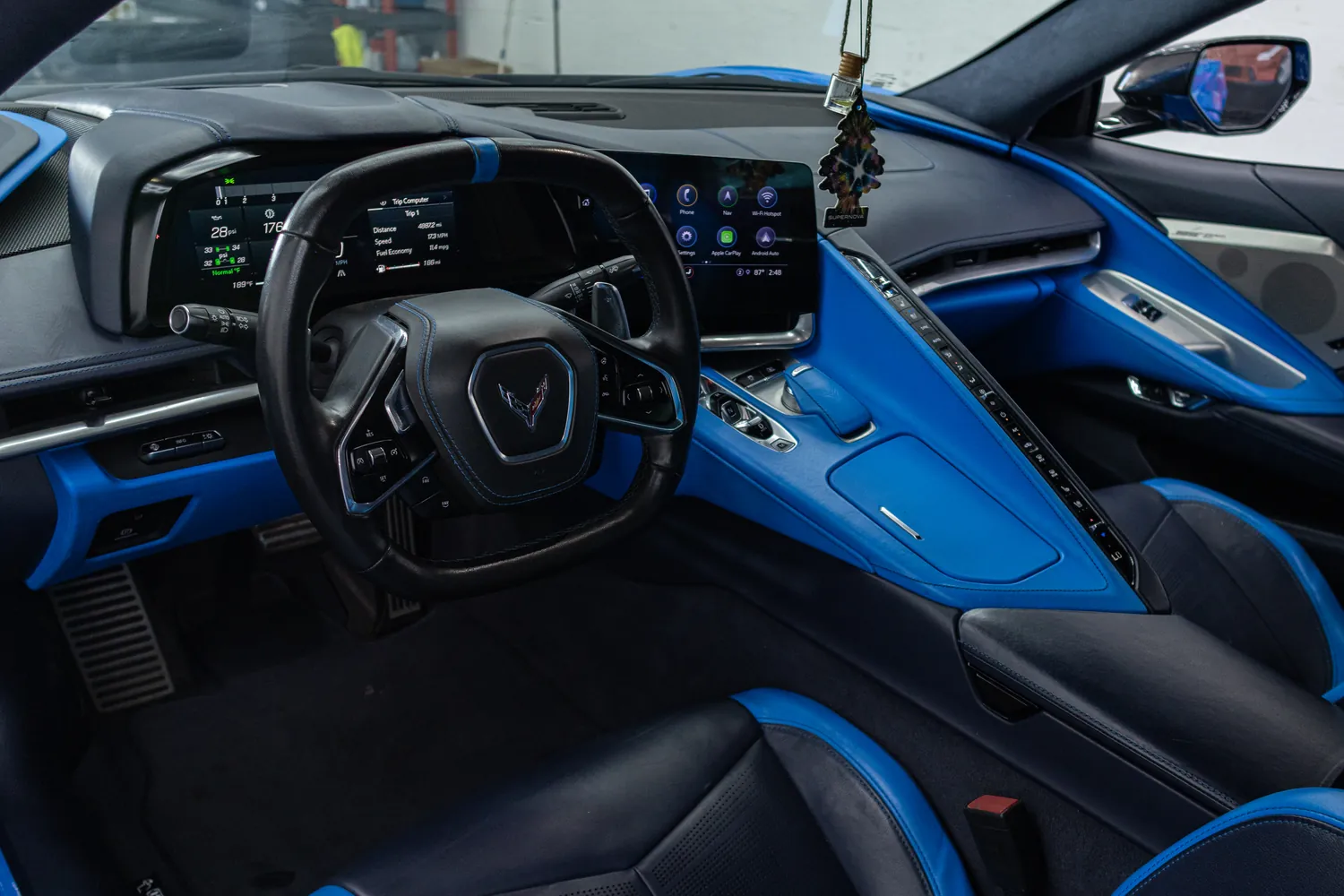 Corvette Stingray cockpit with blue trim and digital displays