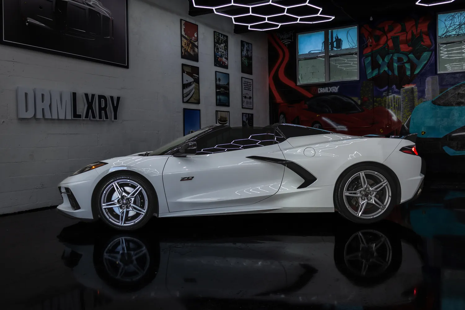 Side profile of the white Corvette Stingray Convertible with the top down