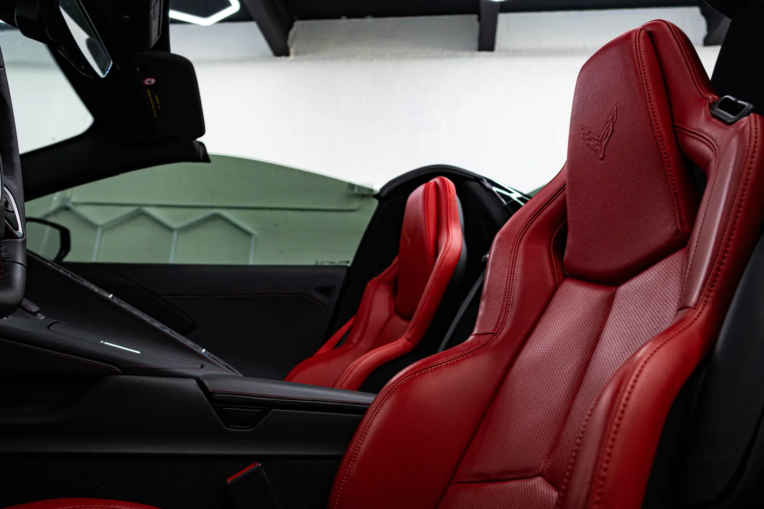 Red leather sport seats in the white Corvette Stingray Convertible