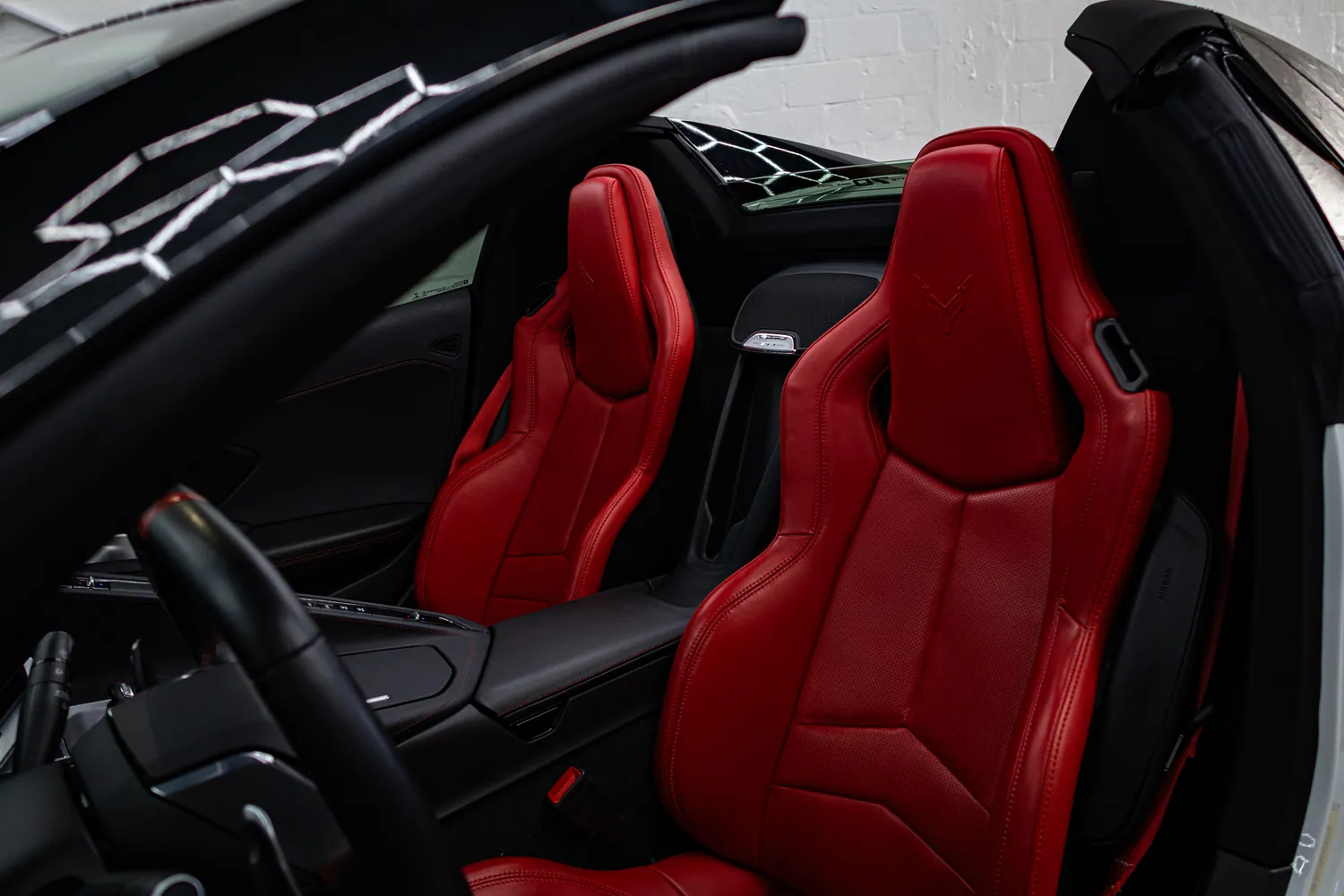 Red leather cabin of the Corvette Stingray Convertible with the top down