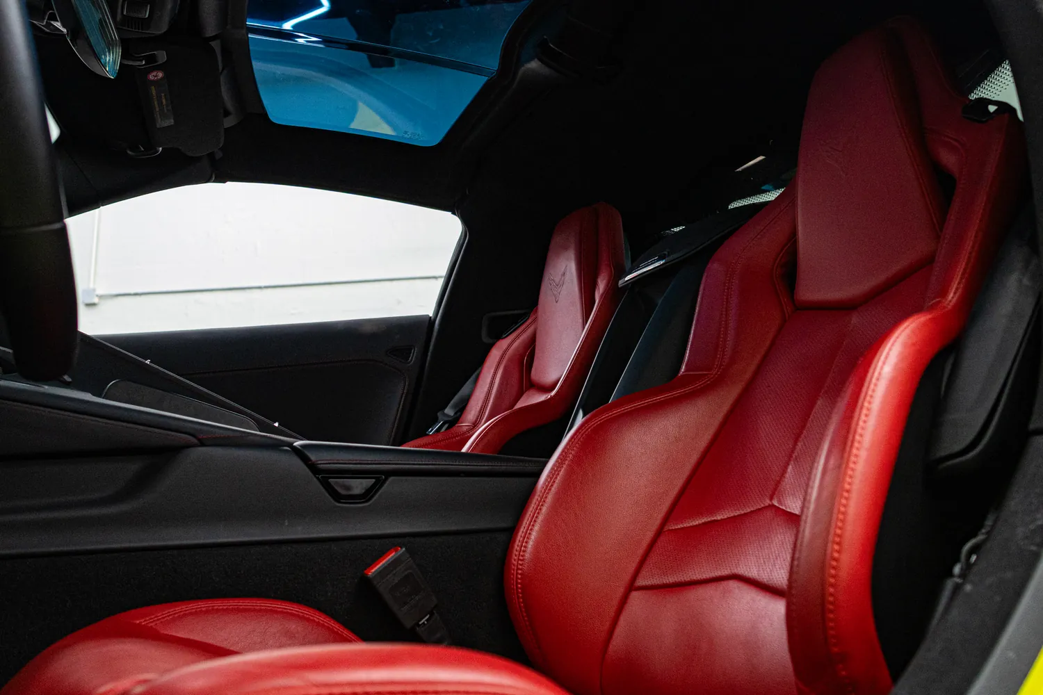 Red leather sport seats in the yellow Corvette Stingray