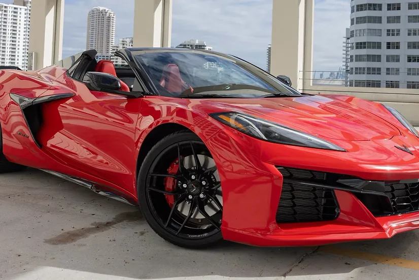 Red Corvette Z06 Convertible with the top down, front three-quarter view