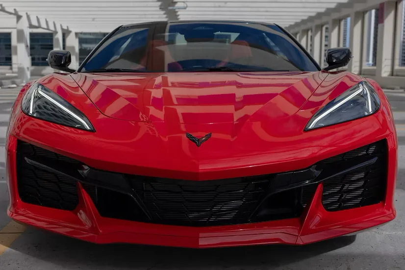 Front view of the red Corvette Z06 showing its wide air intakes