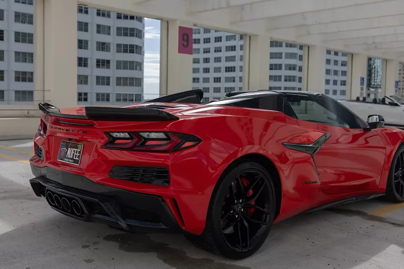 Red Corvette Z06, rear three-quarter view with quad center exhaust