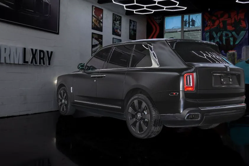 Black Rolls-Royce Cullinan, rear three-quarter view
