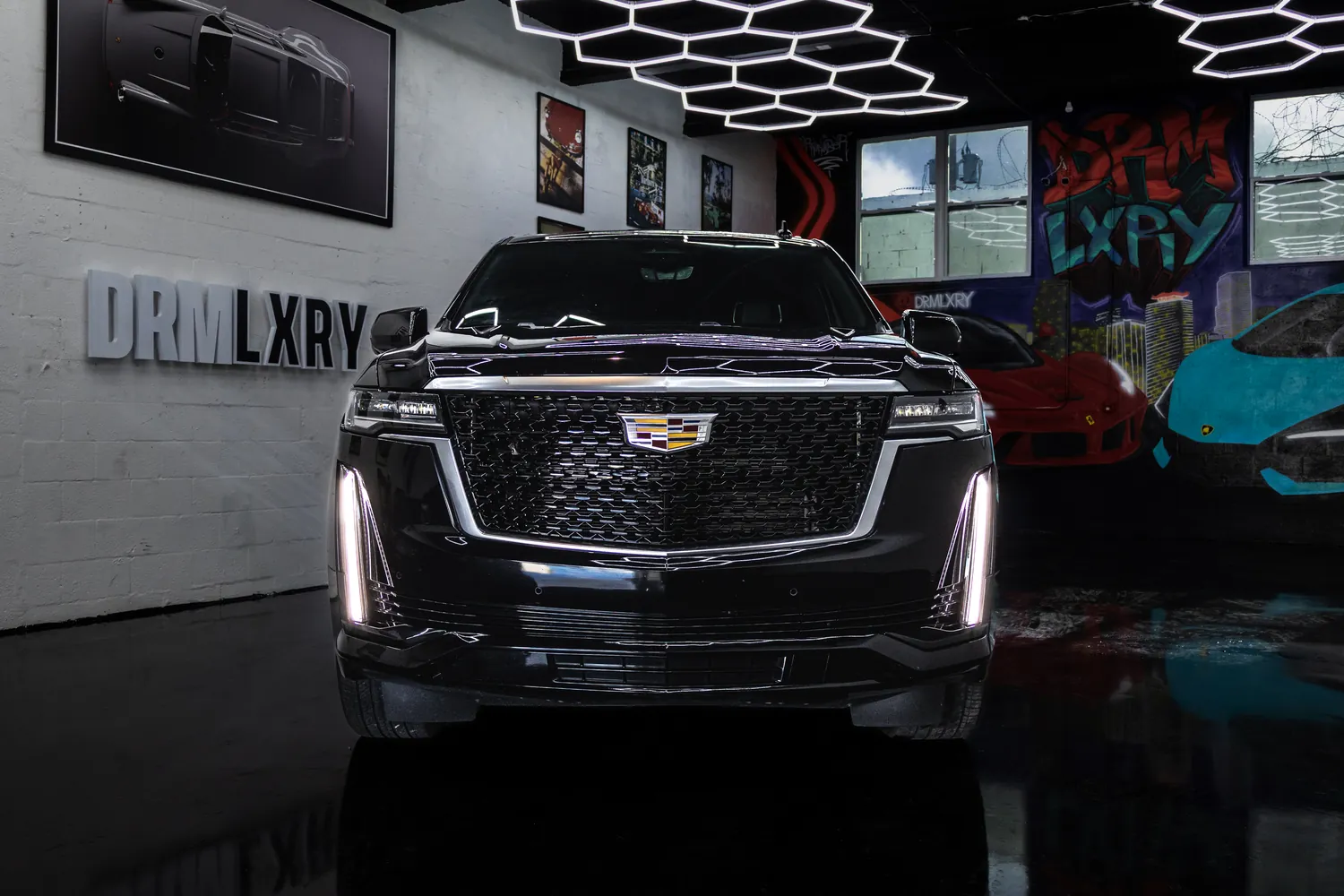 Front view of the black Cadillac Escalade with its vertical LED lights