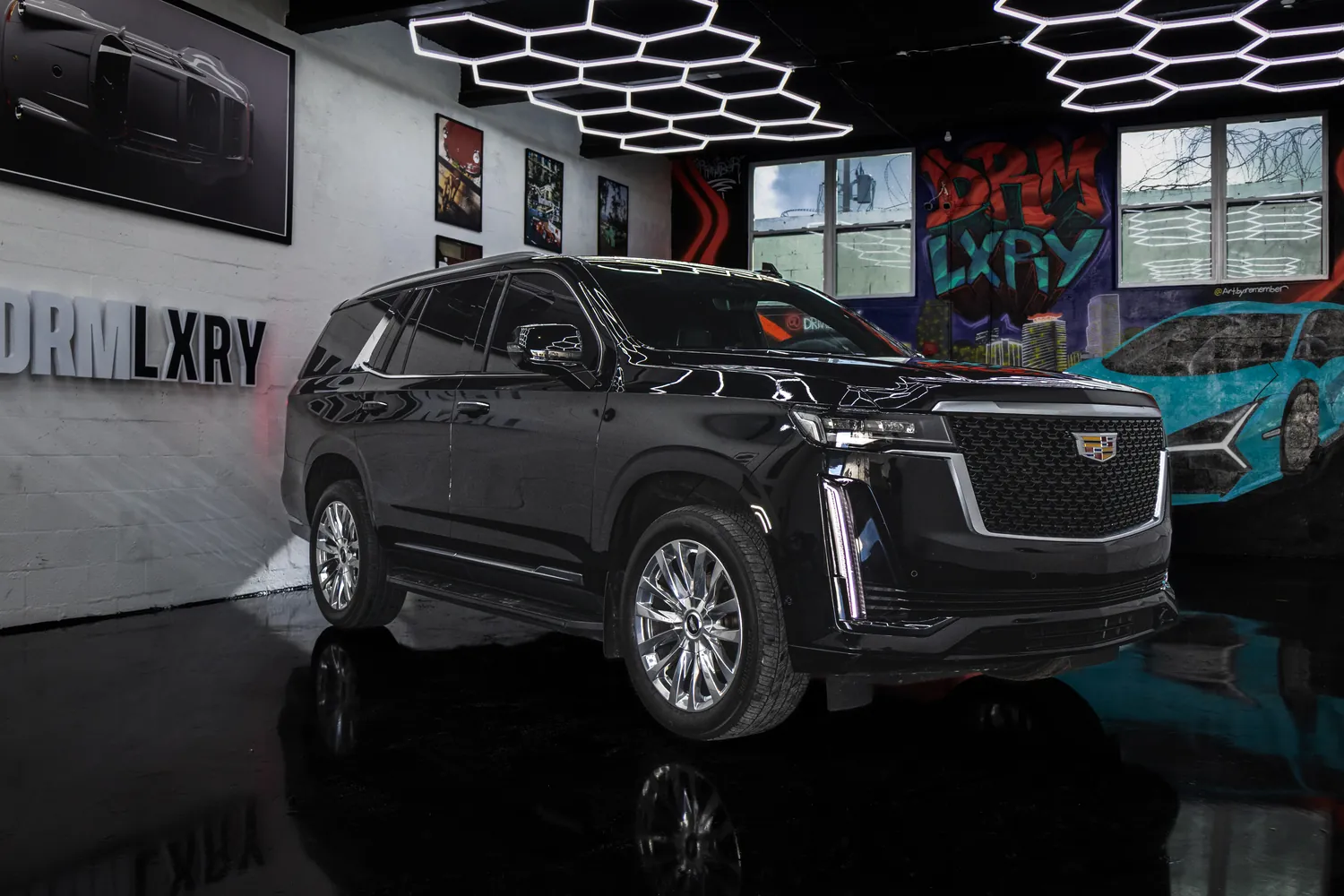 Black Cadillac Escalade, front three-quarter view from the right