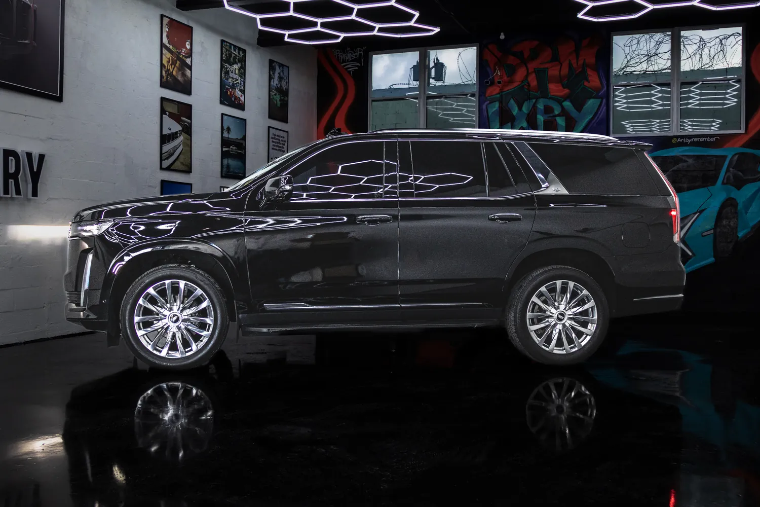 Black Cadillac Escalade side profile from the left