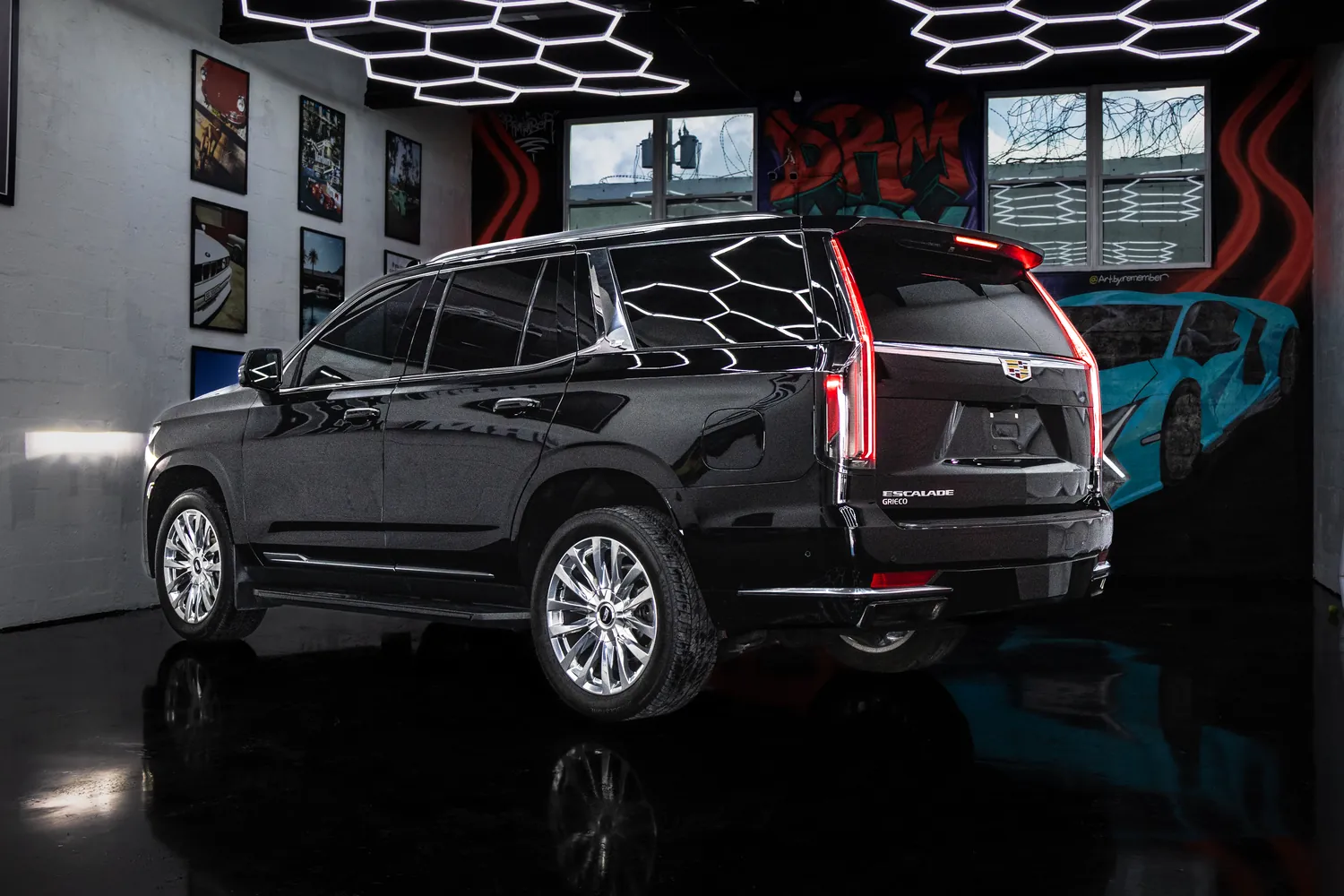 Black Cadillac Escalade, rear three-quarter view