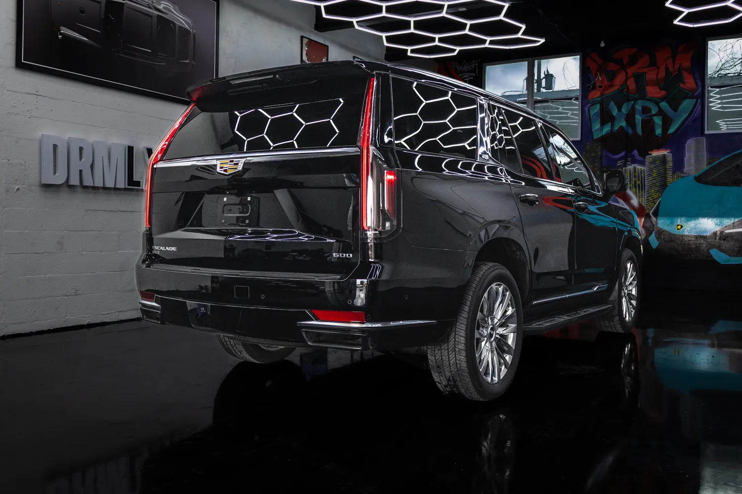 Black Cadillac Escalade, rear three-quarter view from the left