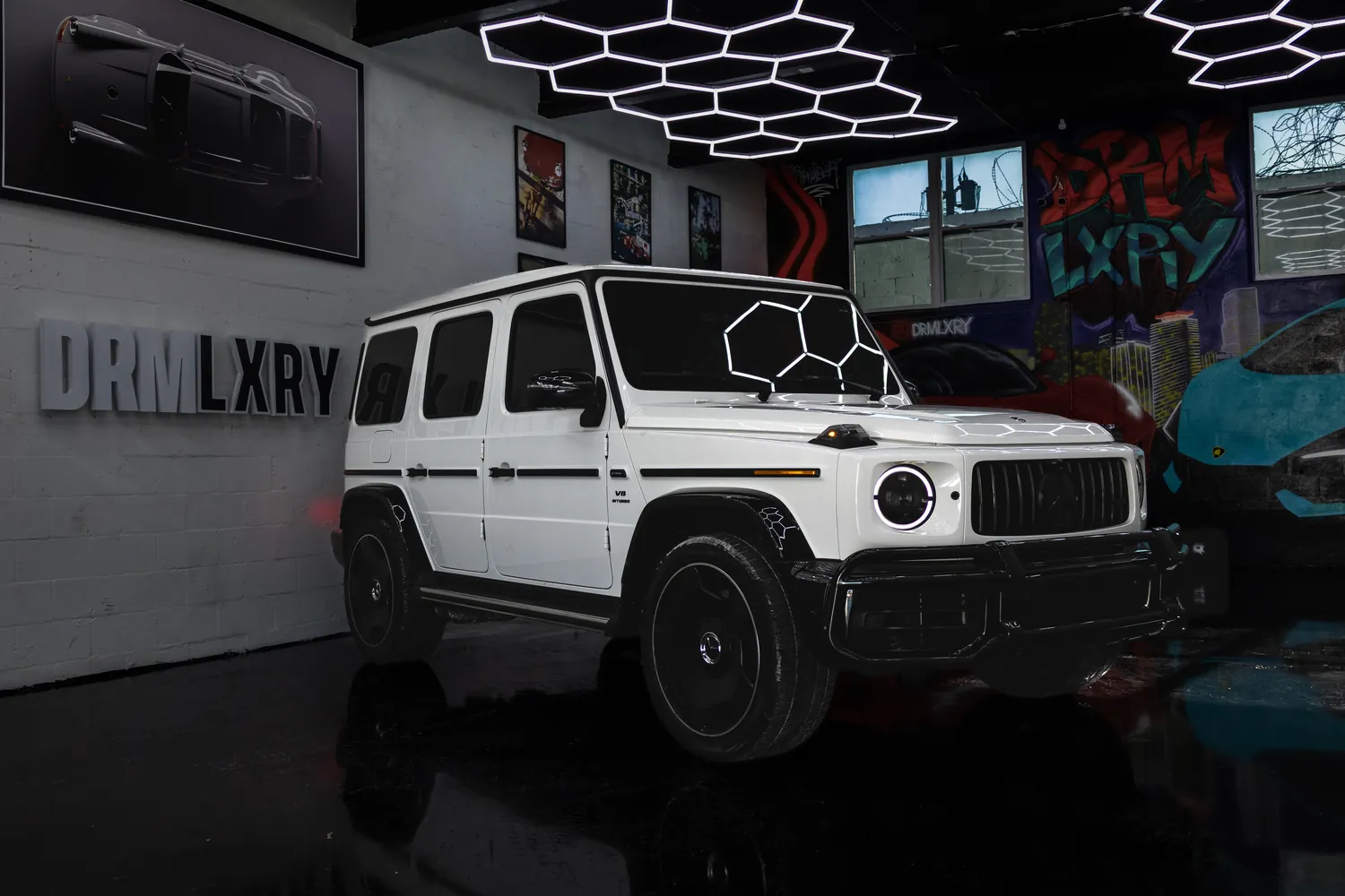 White Mercedes-AMG G63, front three-quarter view from the right
