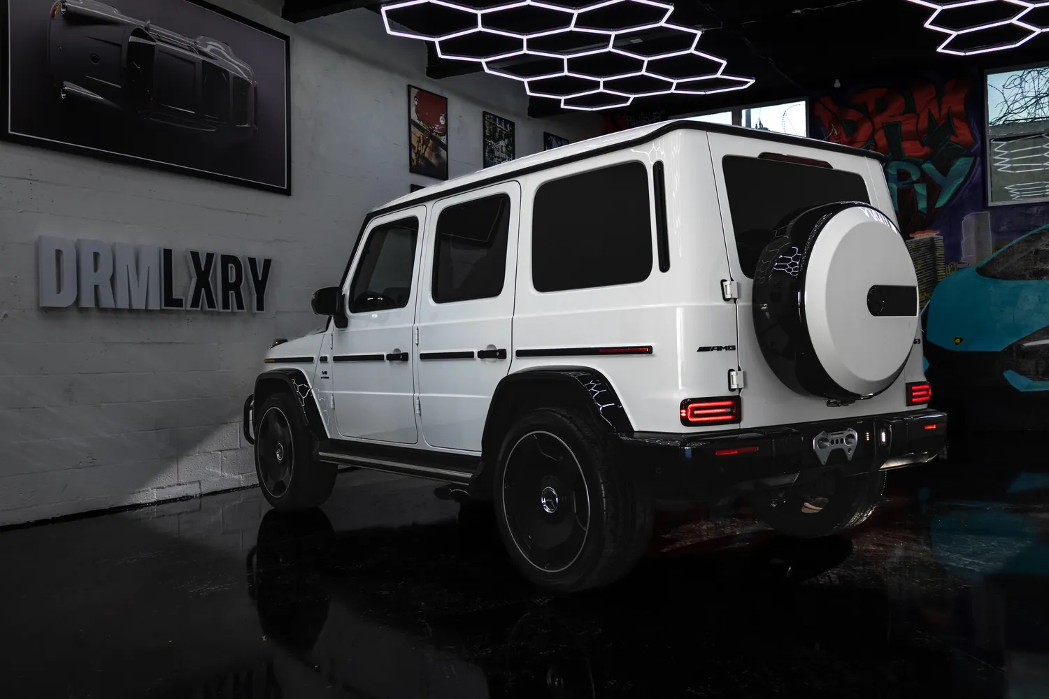 White Mercedes-AMG G63, rear three-quarter view with the spare wheel
