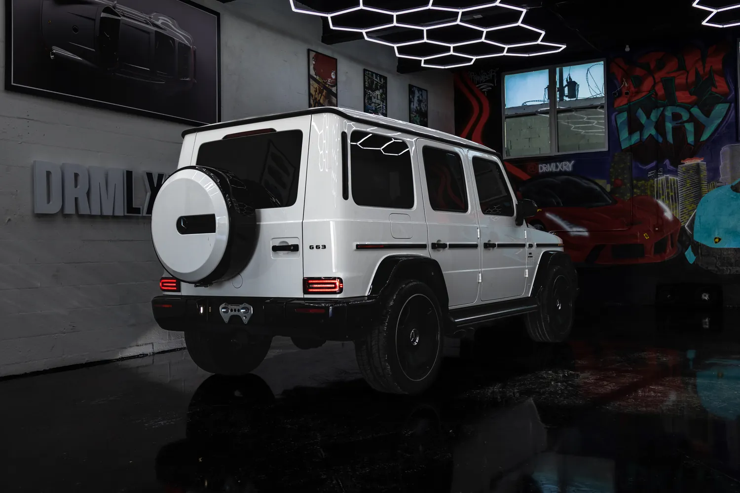 White Mercedes-AMG G63, rear three-quarter view from the left