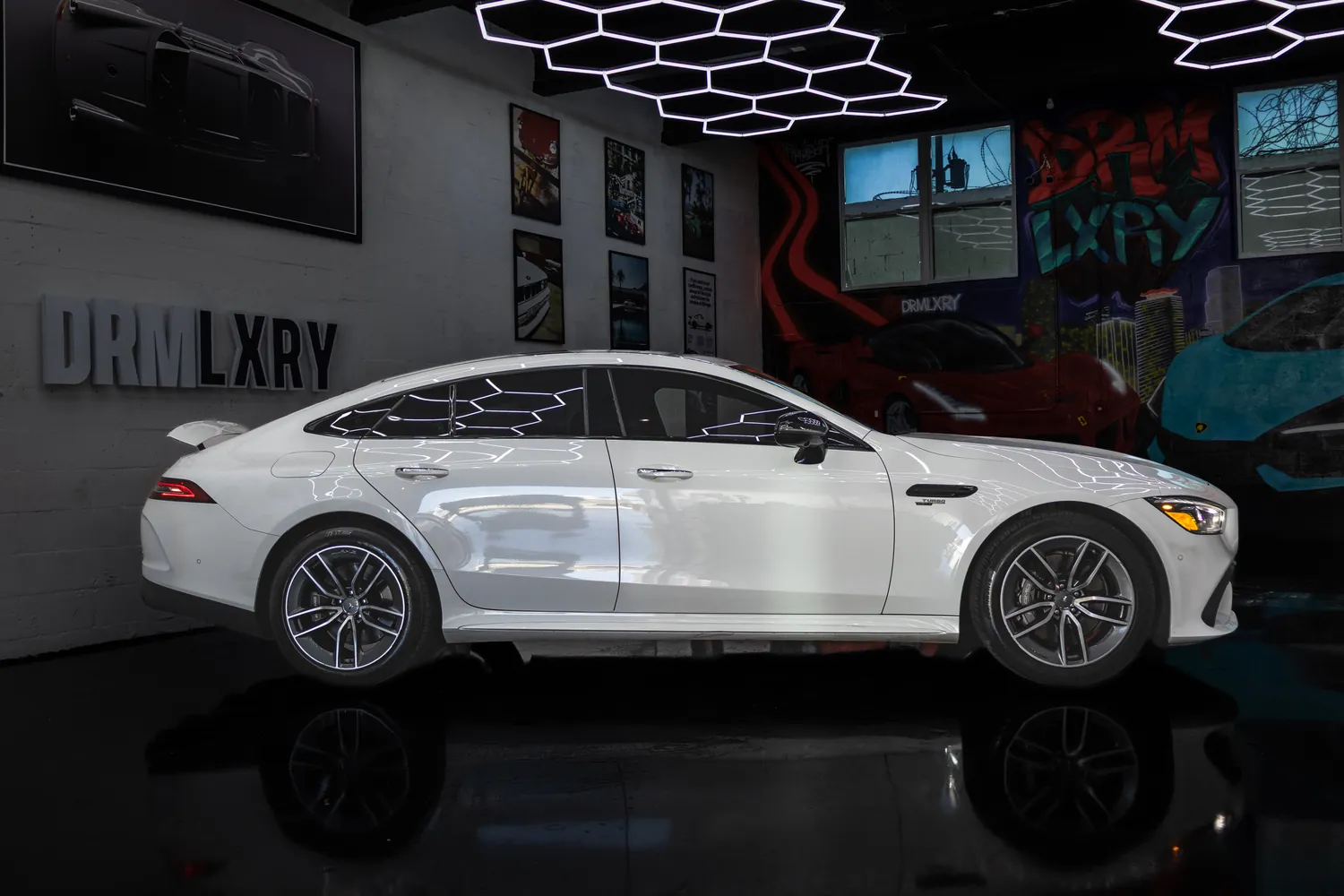 White Mercedes-AMG GT53 side profile from the right