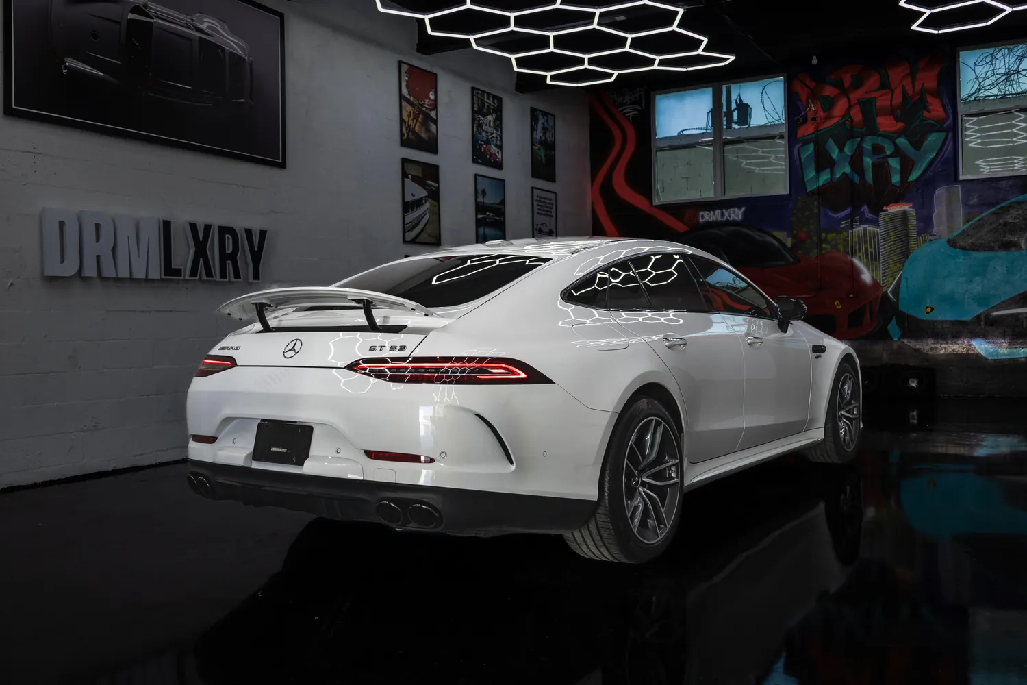 White Mercedes-AMG GT53, rear three-quarter view with its rear spoiler