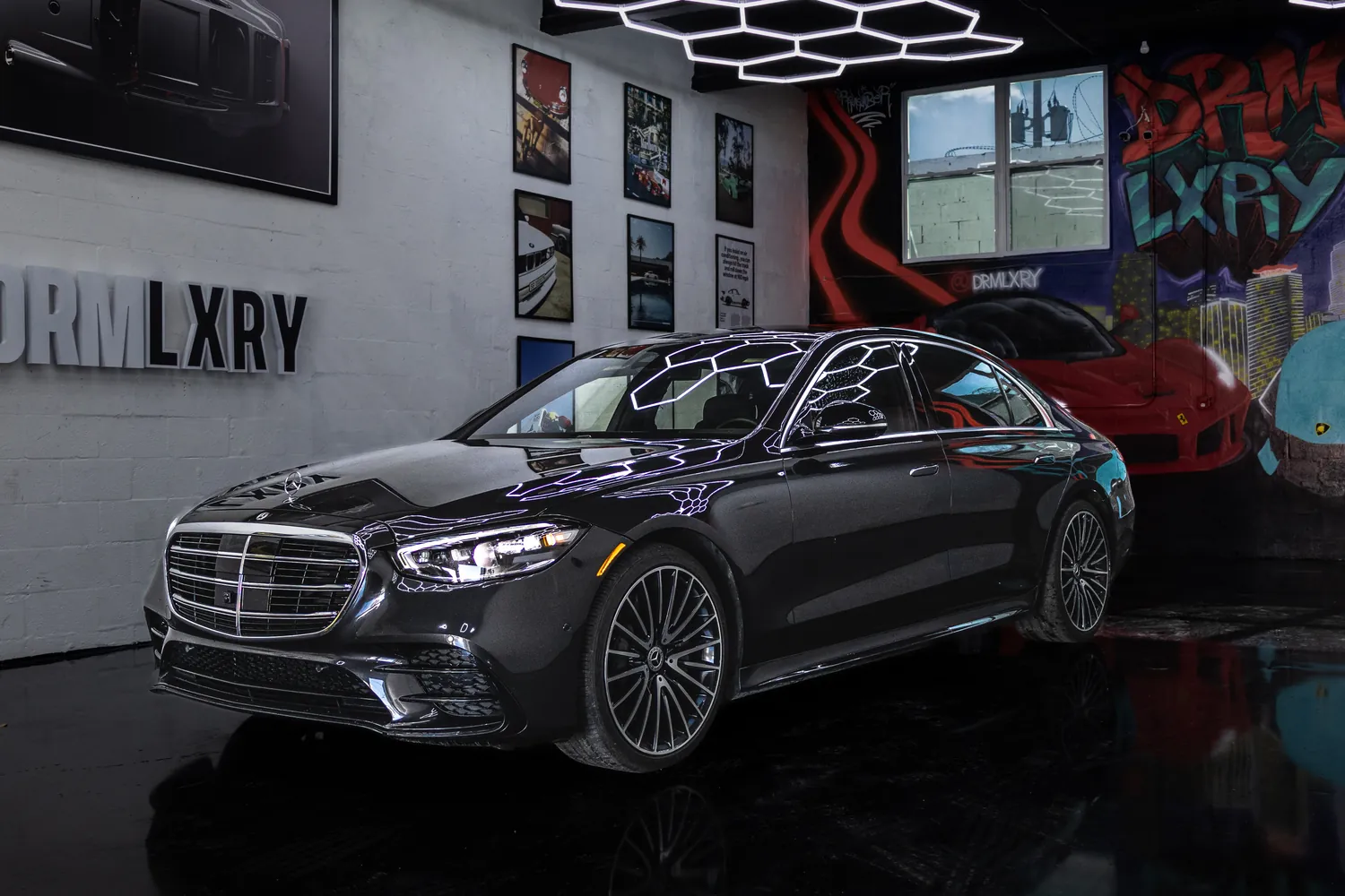 Black 2022 Mercedes-Benz S580, front three-quarter view facing left, in the DRMLXRY Miami showroom