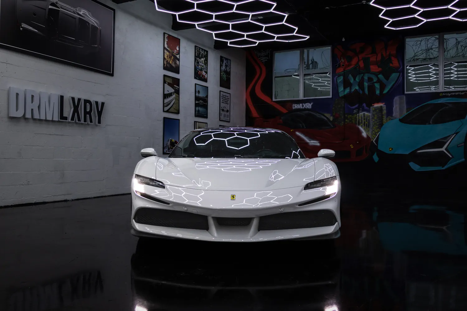 Front view of the white Ferrari SF90 Stradale with its slim LED headlights