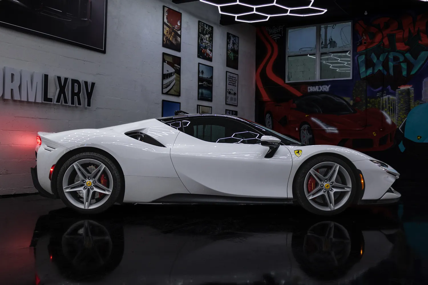 White Ferrari SF90 Stradale side profile from the right with its rear intakes